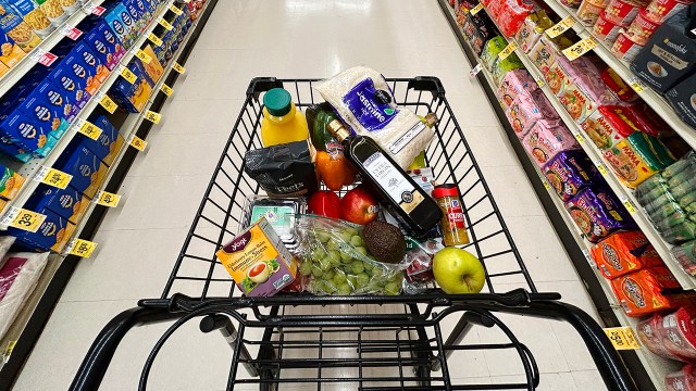 This illustration shows a shopping cart with items that could be affected by tariffs at a store in Annapolis, Maryland, on April 4, 2025. Markets extended a global selloff on April 4 as countries around the world reeled from US President Donald Trump's trade war, but the White House insisted the American economy will emerge victorious. Shock waves tore through markets in the United States, Europe and Asia after Trump's tariff bombshell, as foreign leaders signaled readiness to negotiate but also threatened counter-tariffs. (Photo by Jim WATSON / AFP) (Photo by JIM WATSON/AFP via Getty Images)